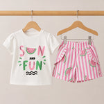 Children's t-shirt and shorts set with watermelon design on a beige background