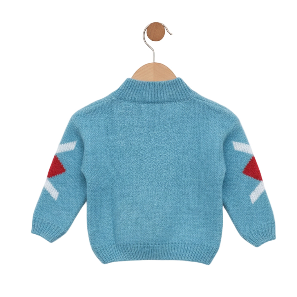 Blue children's sweater with red and white patterns on a hanger against a light gray background