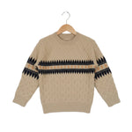 Beige sweater with black pattern on a hanger against a white background