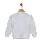 White sweater on a wooden hanger against a white background