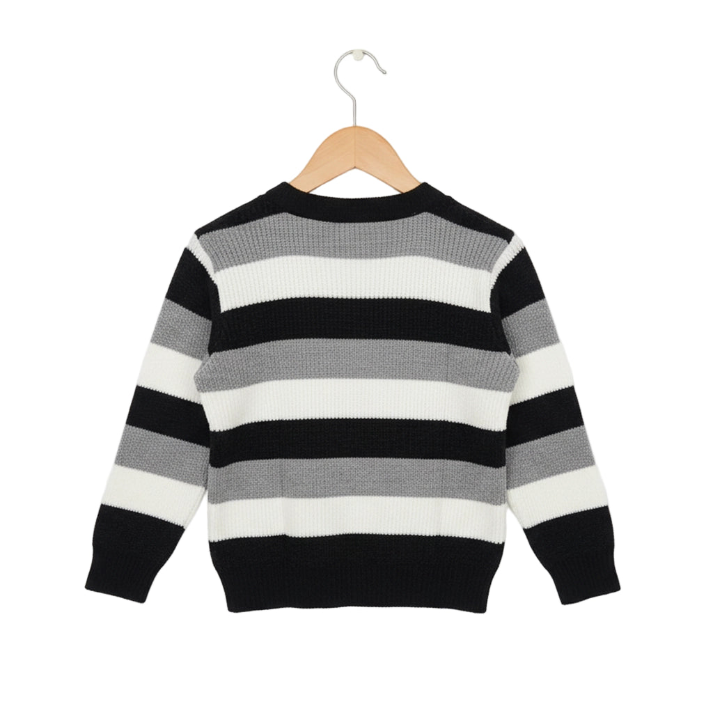 Black, white, and gray striped sweater on a hanger against a white background