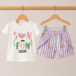 Children's outfit with 'Sun and Fun' t-shirt and striped shorts on hangers against a beige background