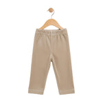 Beige baby pants on a wooden hanger against a white background