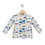 Children's long-sleeve shirt with dog pattern on a hanger against a white background
