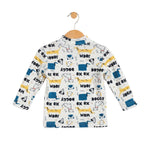 Children's long-sleeve shirt with dog pattern on a hanger against a white background
