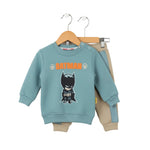 Children's outfit with Batman-themed sweatshirt and pants on hangers against a white background
