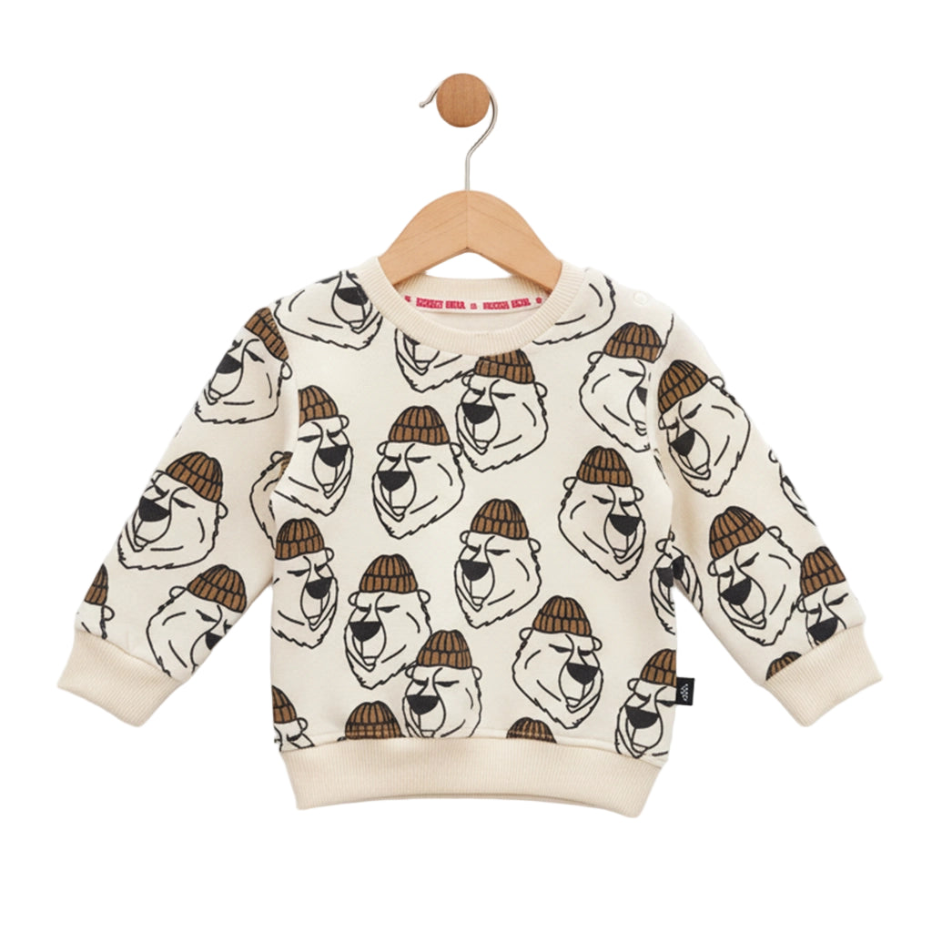 Children's sweater with bear pattern on a hanger against a white background