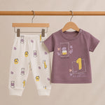 Children's t-shirt and pants with animal prints on a beige background