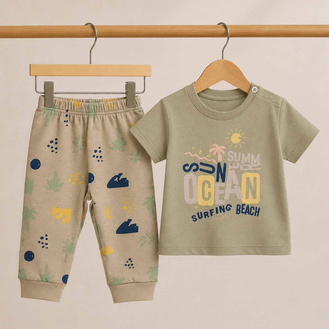 Children's outfit with t-shirt and pants on hangers against a beige background