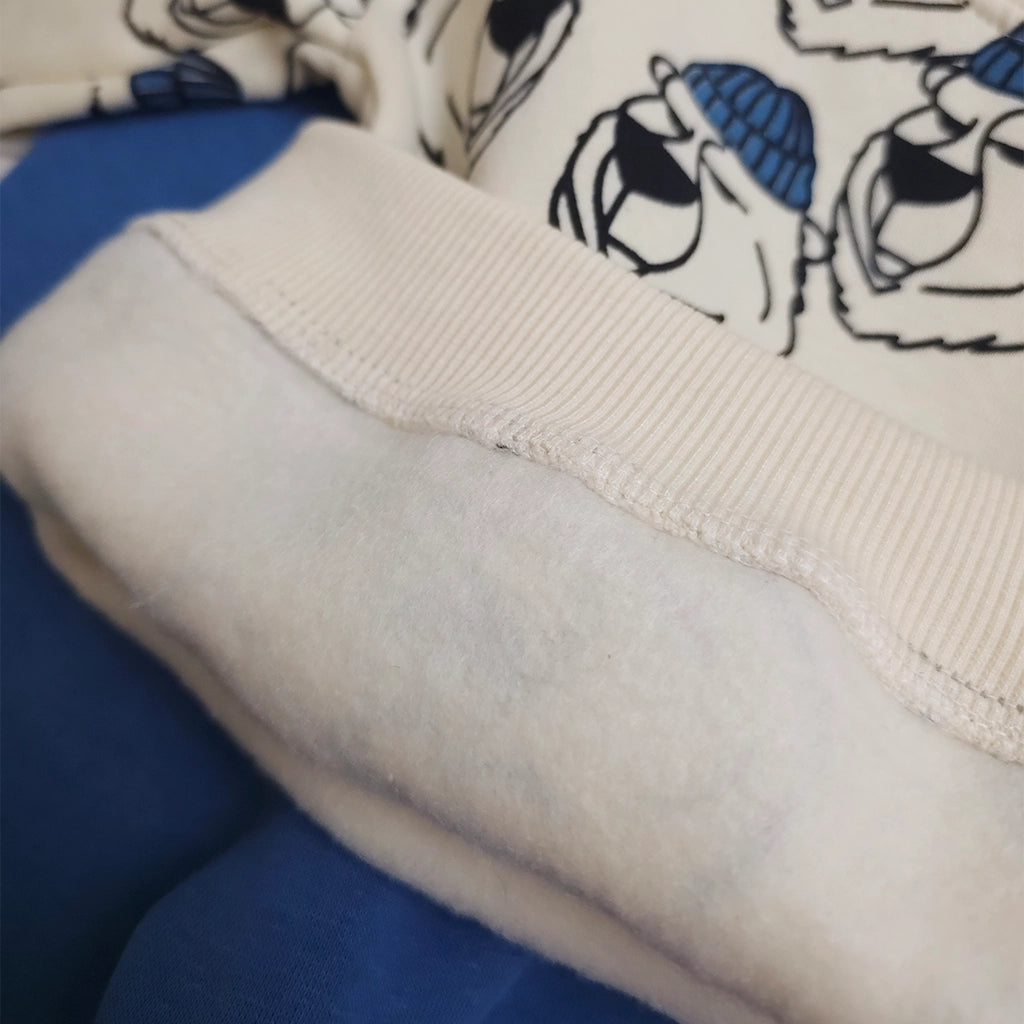 Close-up of a fabric with cartoon characters and blue accents