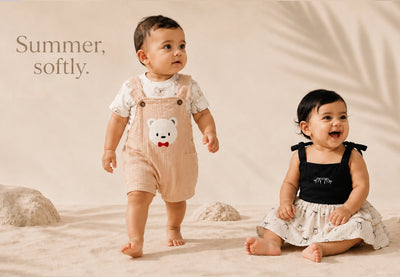 Two babies in summer outfits with text 'Summer, softly.' on a neutral background