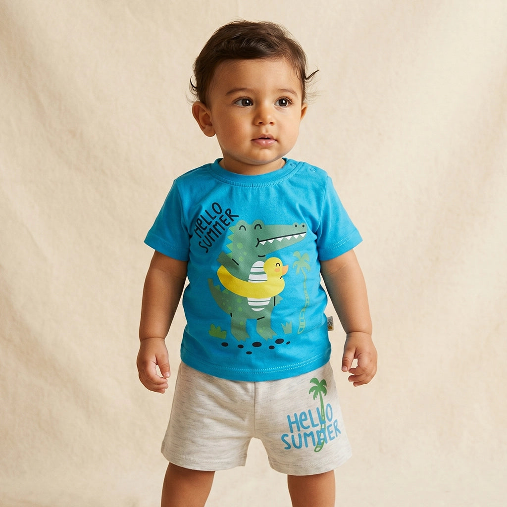 Child wearing a blue t-shirt with a dinosaur and rubber duck graphic, and gray shorts with 'Hello Summer' text.