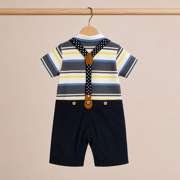 Children's outfit with striped shirt, suspenders, and shorts on a beige background