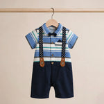 Children's outfit with striped shirt, navy shorts, and suspenders on a beige background
