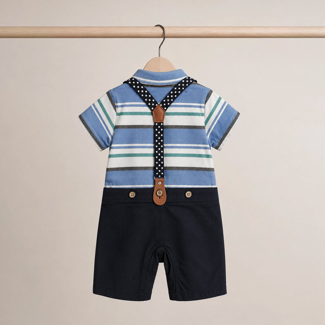 Children's outfit with striped shirt, suspenders, and black shorts on a beige background