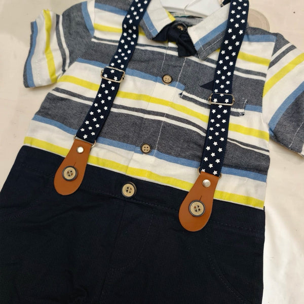 Children's outfit with striped shirt, suspenders, and dark pants on a light background