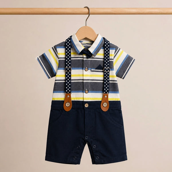 Children's outfit with striped shirt and navy shorts on a beige background