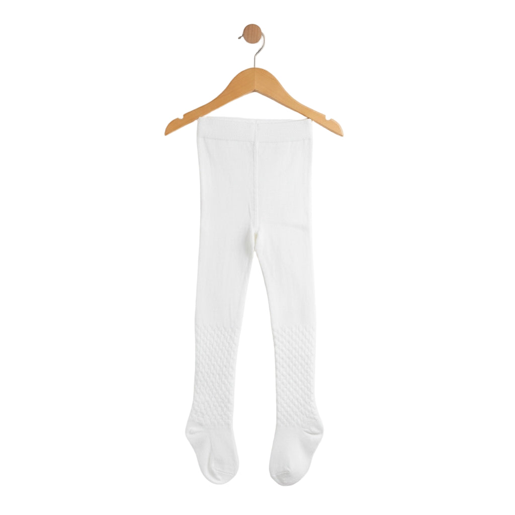 White tights hanging on a wooden hanger against a white background