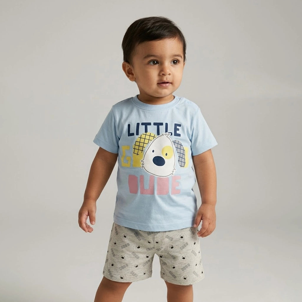 Child wearing a light blue t-shirt with text and graphics, standing against a plain background
