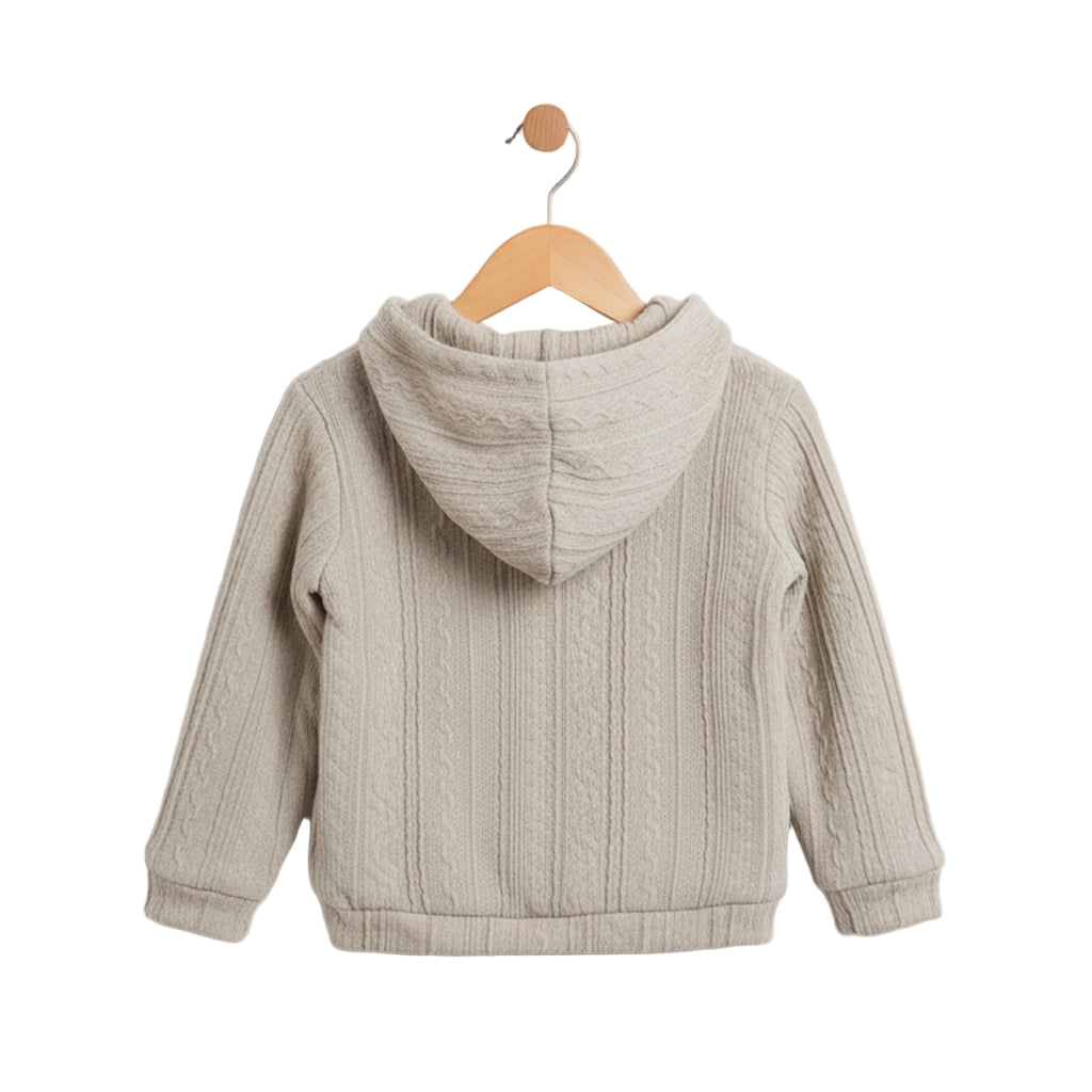 Beige children's jacket on a wooden hanger against a light gray background