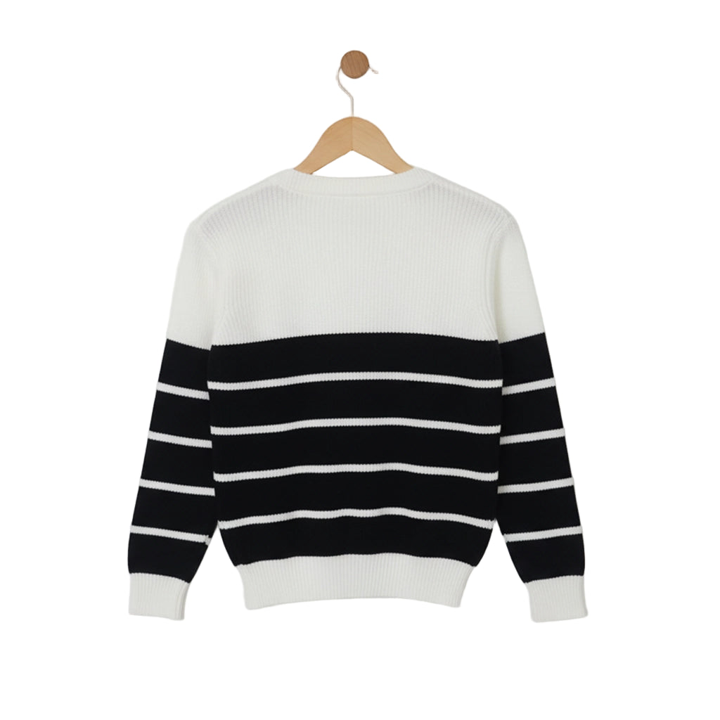 Black and white striped sweater on a wooden hanger against a light gray background