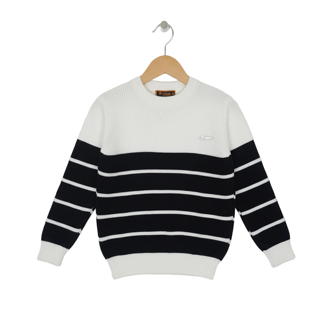 Black and white striped sweater on a hanger against a white background