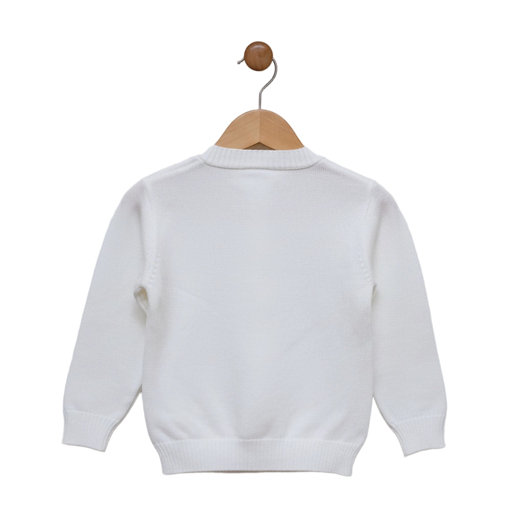White sweater on a wooden hanger against a white background