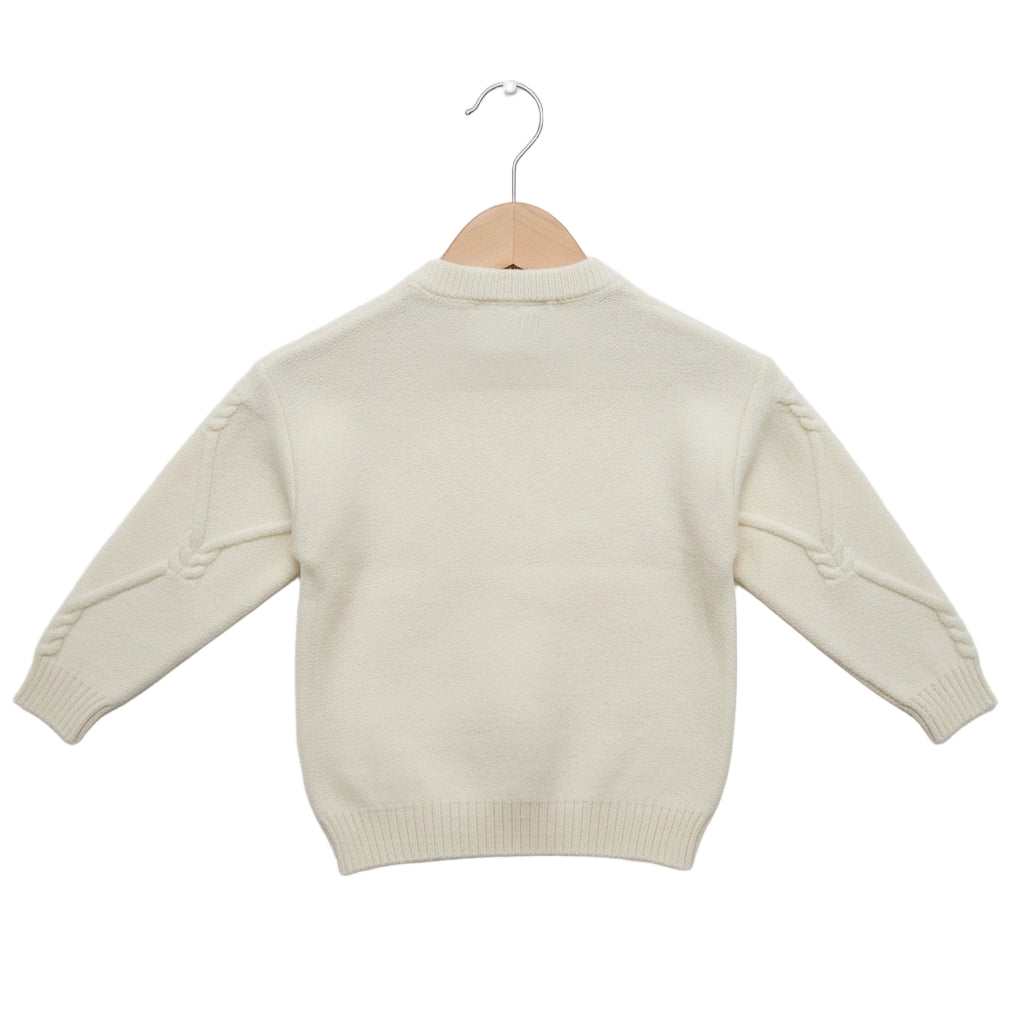 Beige sweater on a wooden hanger against a white background