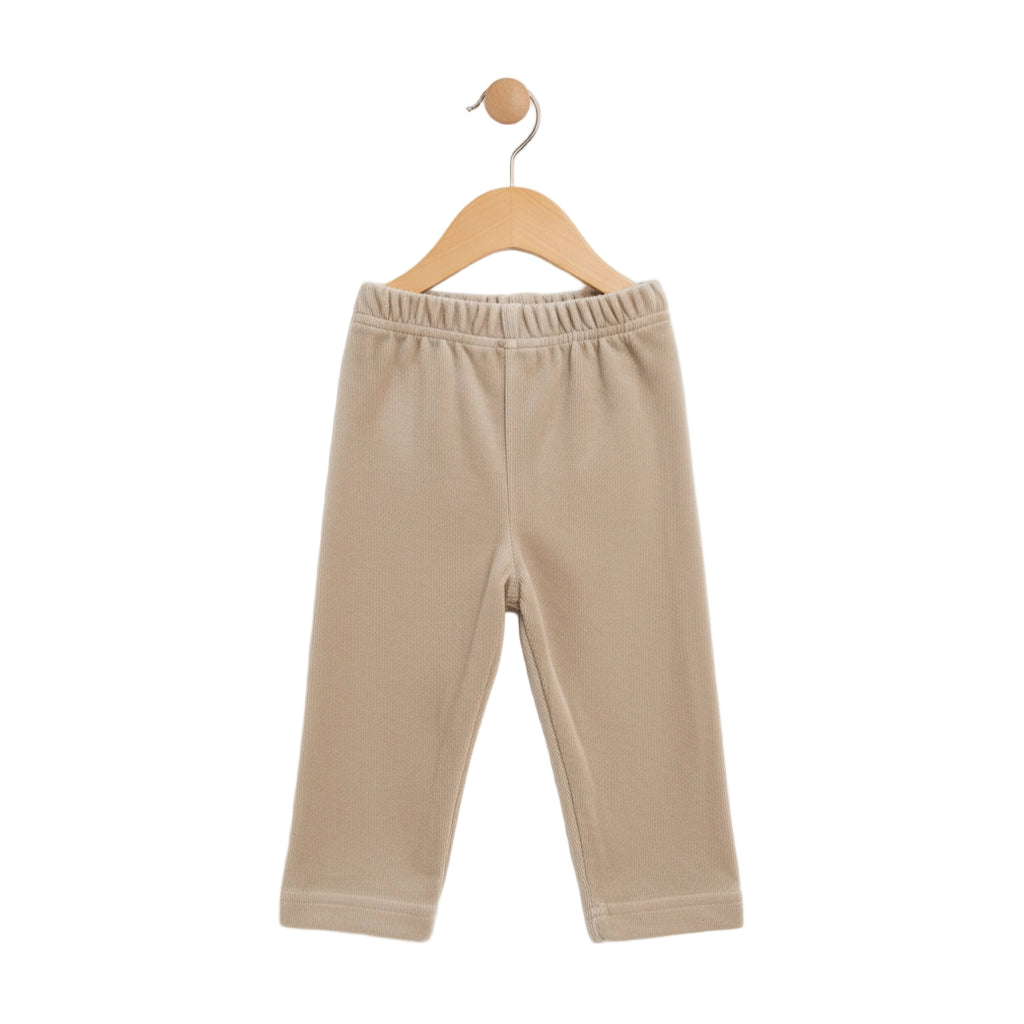 Beige baby pants on a wooden hanger against a white background