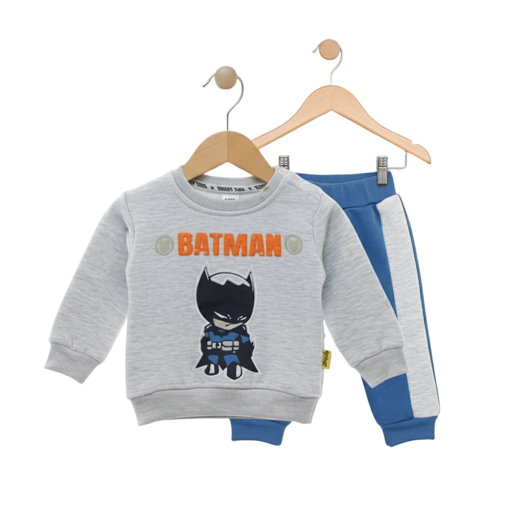 Children's sweatshirt with Batman design on a hanger against a white background