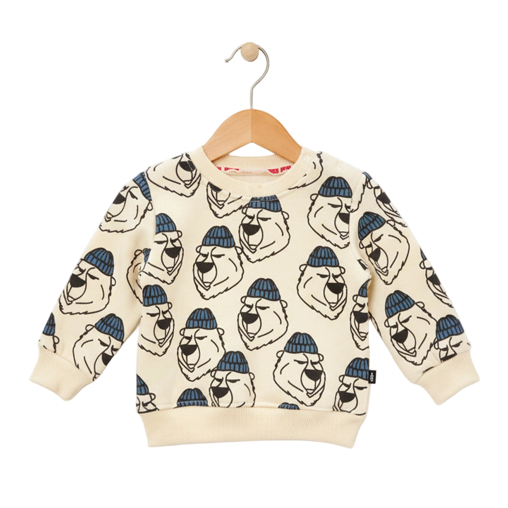 Children's sweater with bear pattern on a hanger against a white background