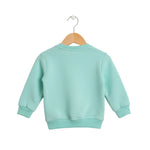Light blue sweatshirt on a wooden hanger against a white background