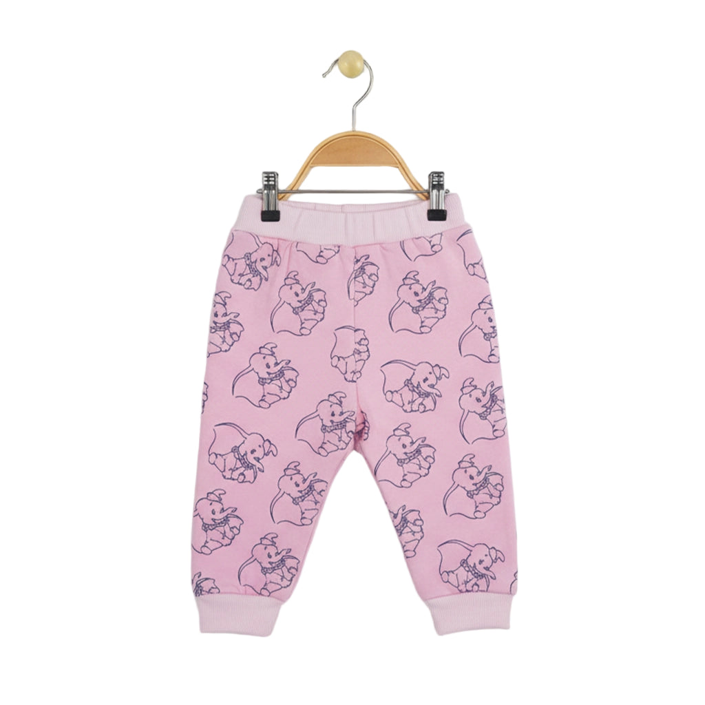 Pink children's pants with a pattern on a hanger against a white background