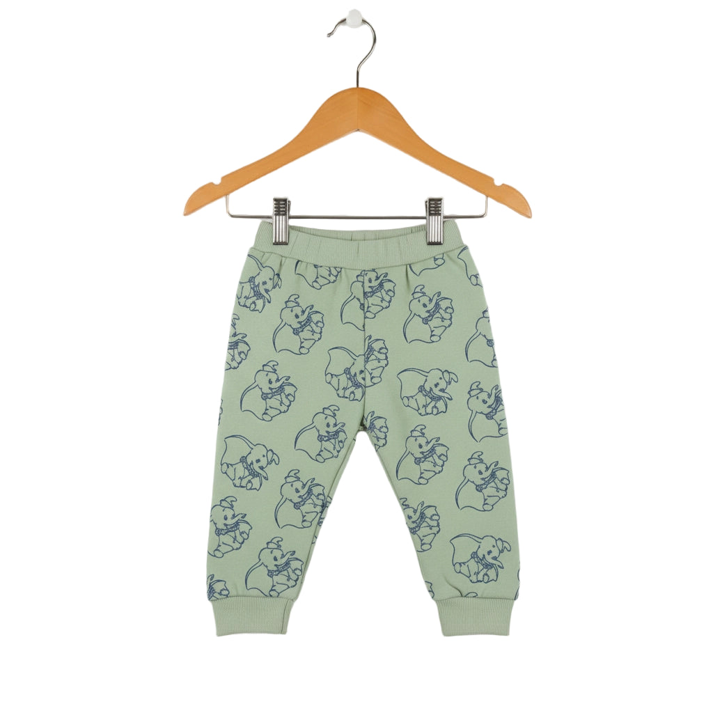 Green children's pants with bear pattern on a hanger against a white background