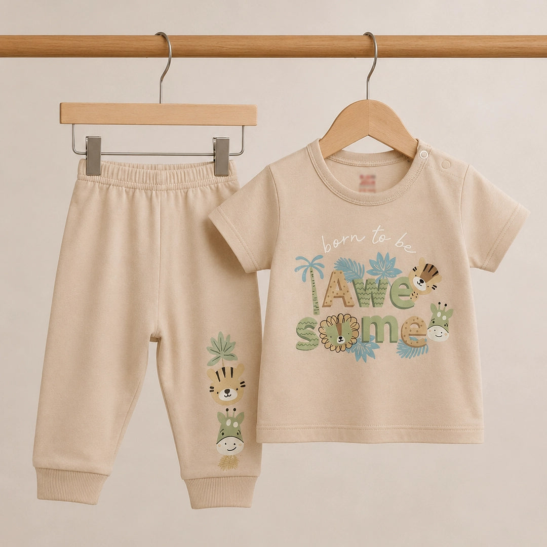 Beige baby outfit with 'Born to be Awesome' text and animal illustrations on a beige background