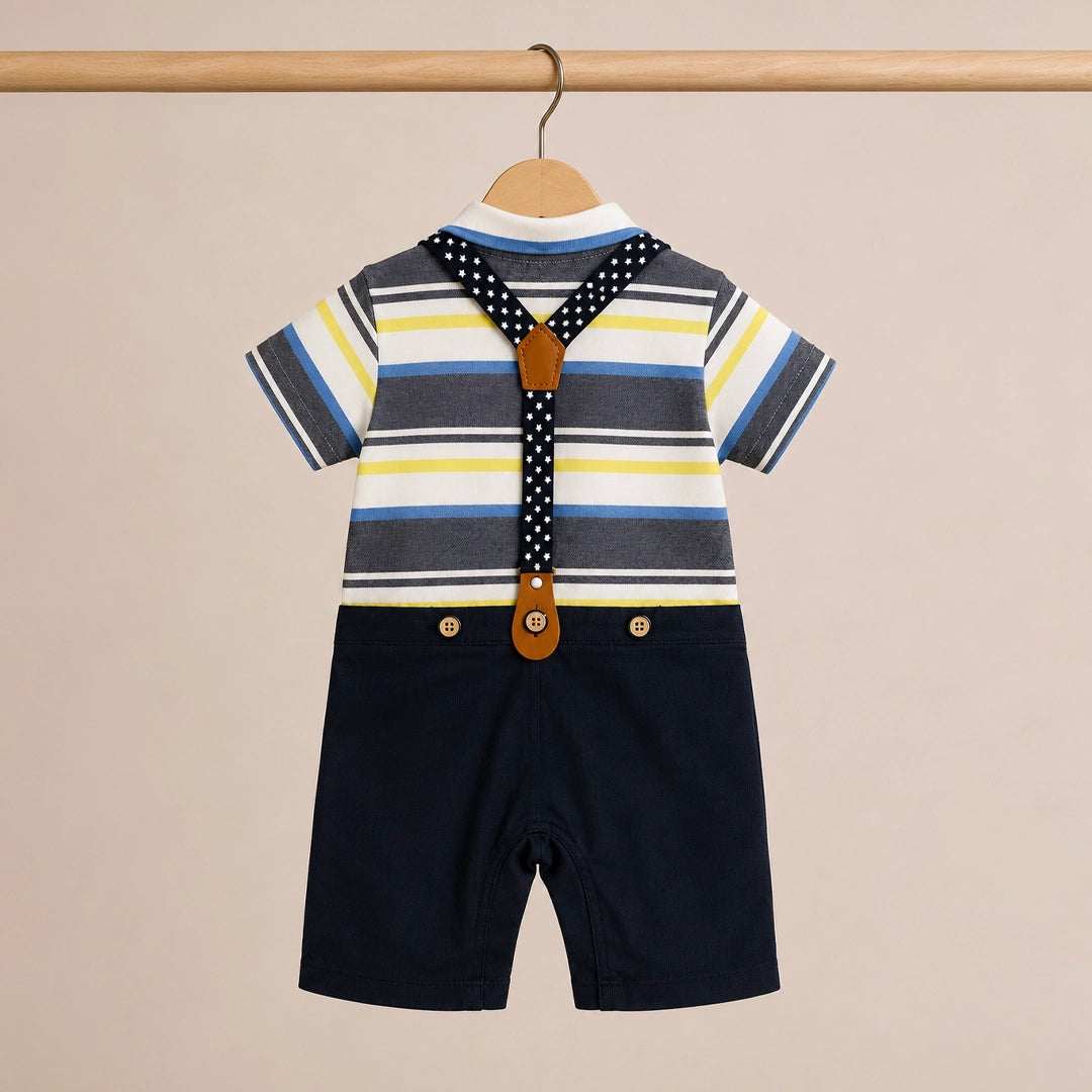 Children's outfit with striped shirt, suspenders, and shorts on a beige background