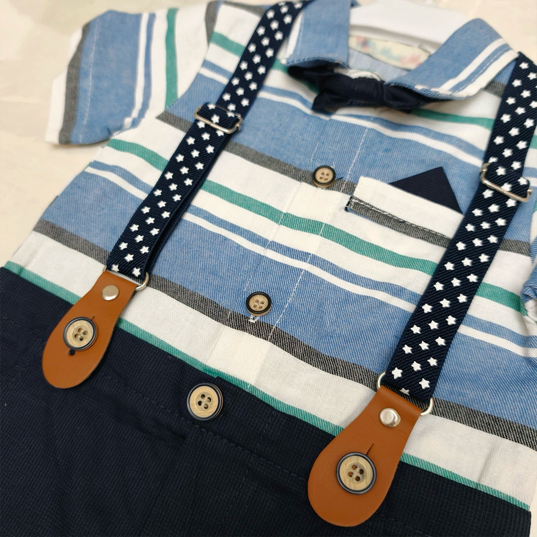 Children's outfit with striped shirt, suspenders, and dark pants on a light background