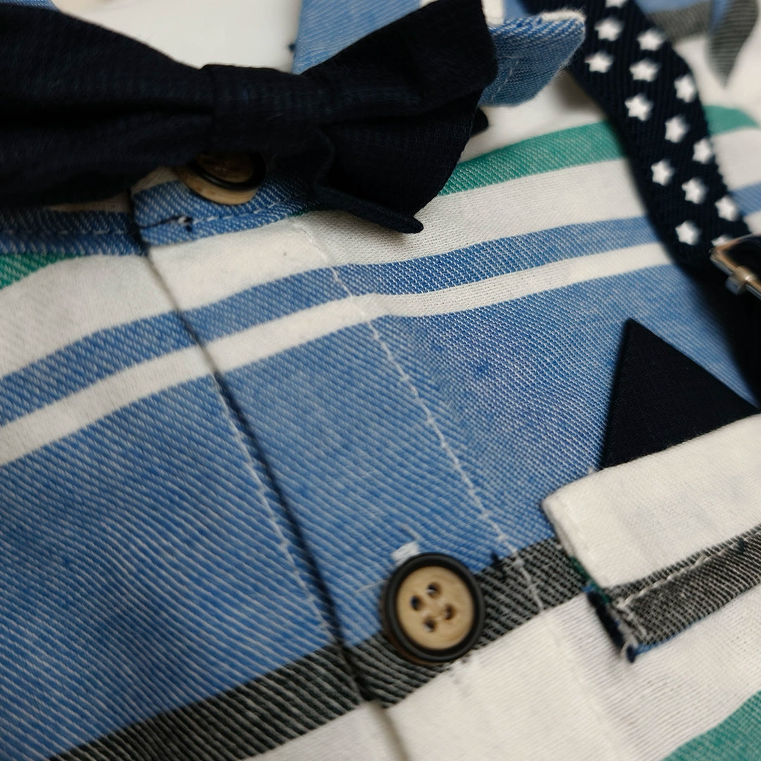 Close-up of a blue and white striped fabric with a button and bow tie.